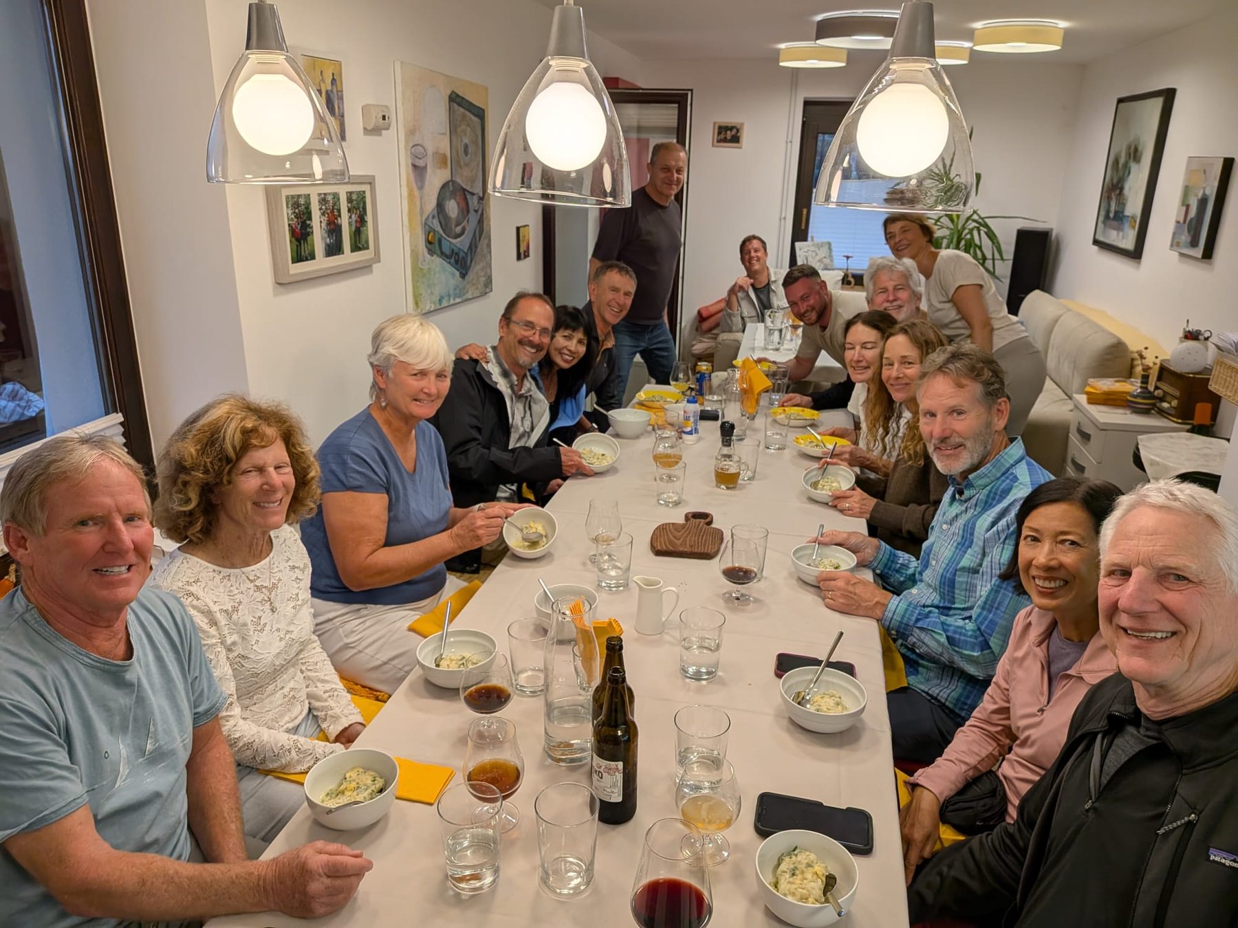 Friends enjoying a group dinner during their cycling tour of Slovenia